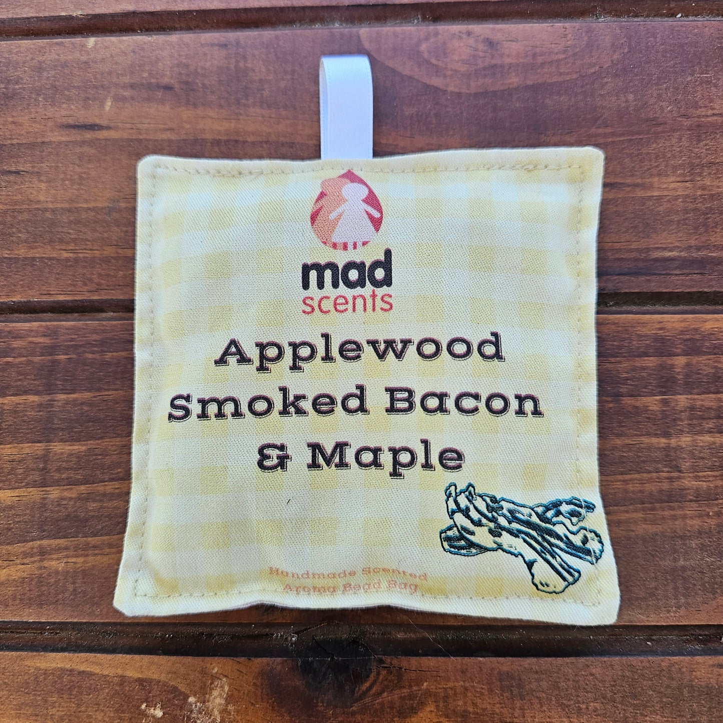 Fabric pouch labeled 'Applewood Smoked Bacon & Maple' by Mad Scents