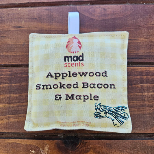Fabric pouch labeled 'Applewood Smoked Bacon & Maple' by Mad Scents 
